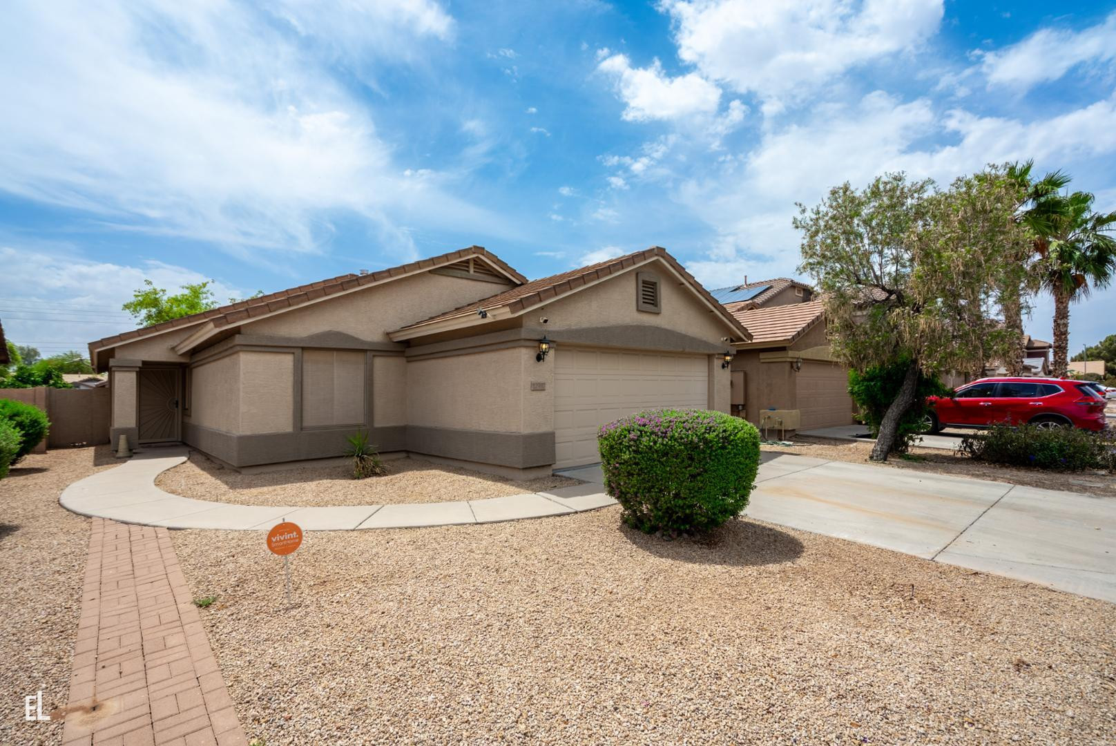 12937 West Bloomfield Road El Mirage, AZ 85335 - Photo 3 of 25 a view of a house with a yard