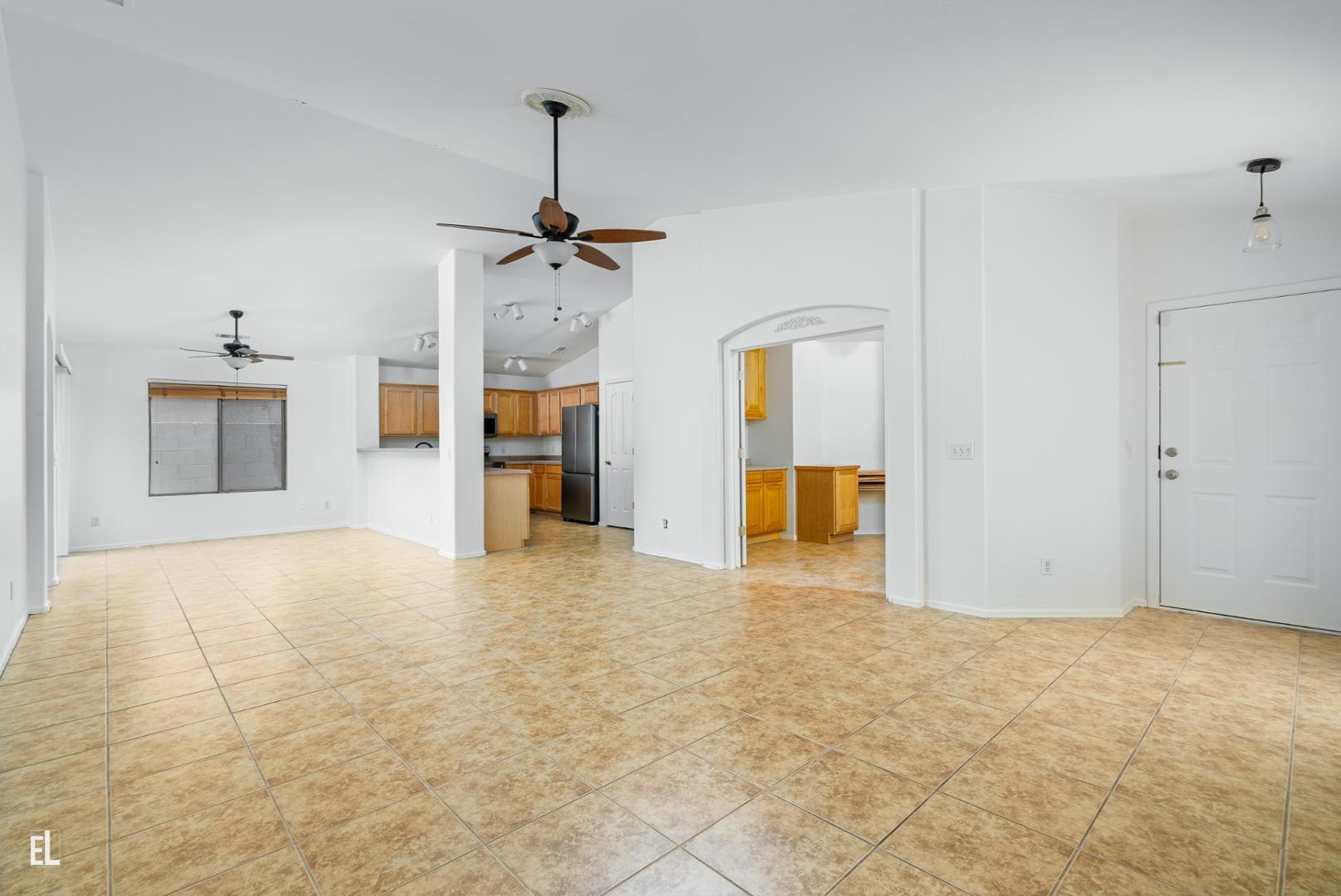 12937 West Bloomfield Road El Mirage, AZ 85335 - Photo 5 of 25 a view of empty room with a kitchen
