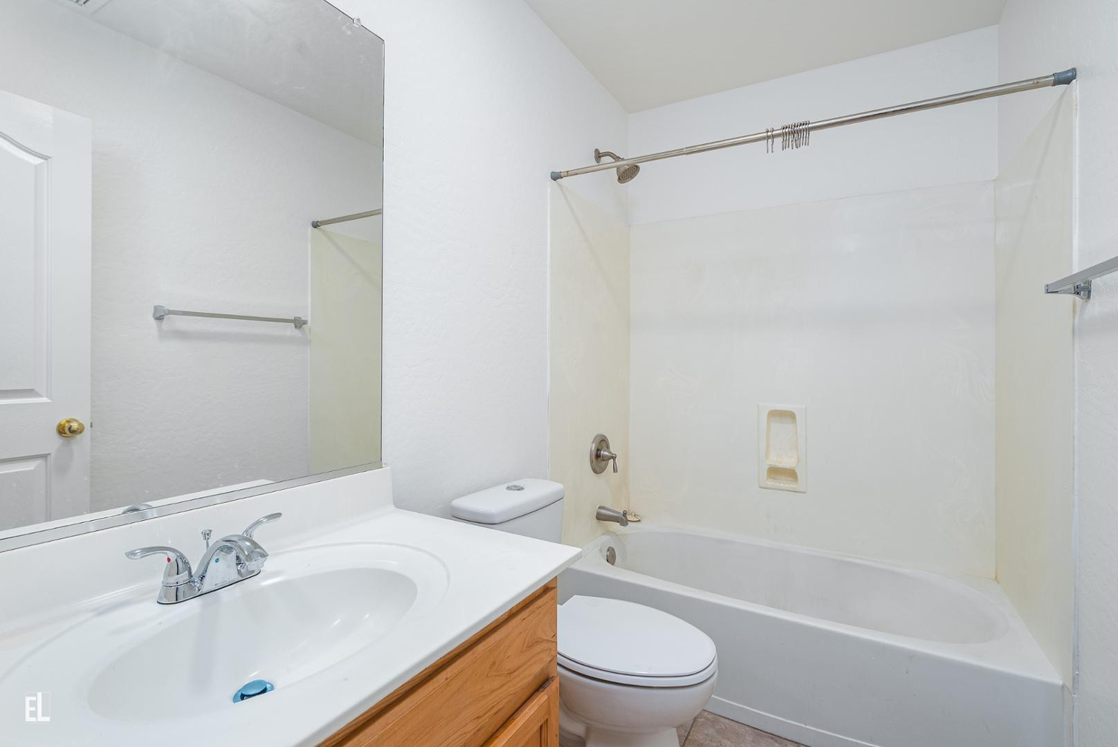 12937 West Bloomfield Road El Mirage, AZ 85335 - Photo 8 of 25 a bathroom with a sink toilet and shower