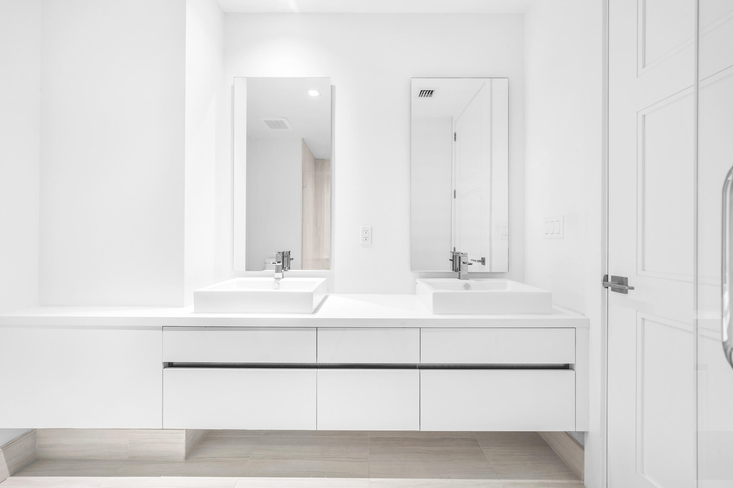 155 East Boca Raton Road, Unit 418 Boca Raton, FL 33432 - Photo 12 of 51 a bathroom with a double vanity sink and mirror