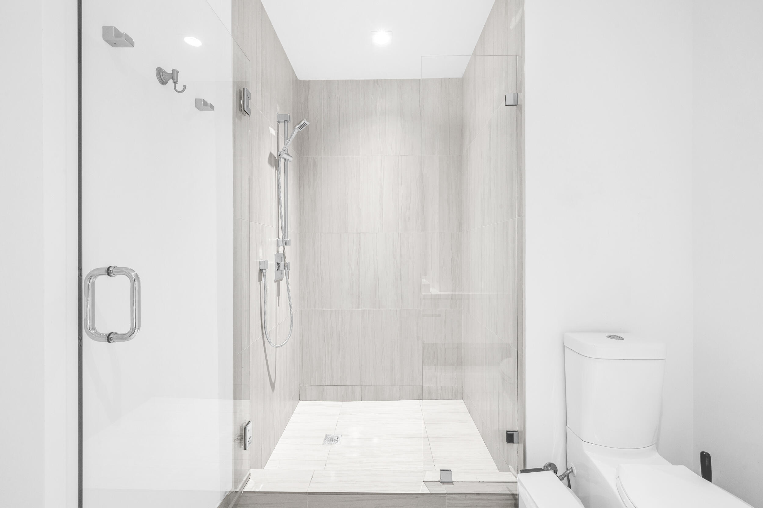 155 East Boca Raton Road, Unit 418 Boca Raton, FL 33432 - Photo 14 of 51 a bathroom with a shower and a toilet