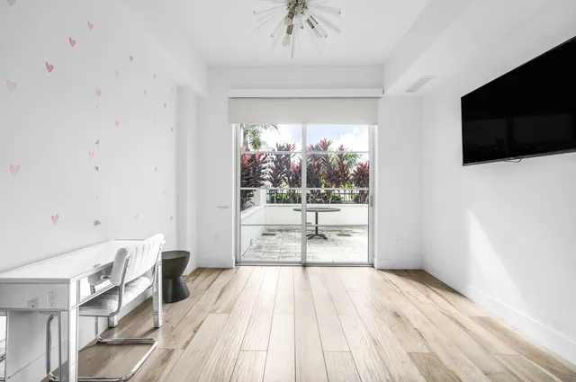 a view of a living room and a flat screen tv