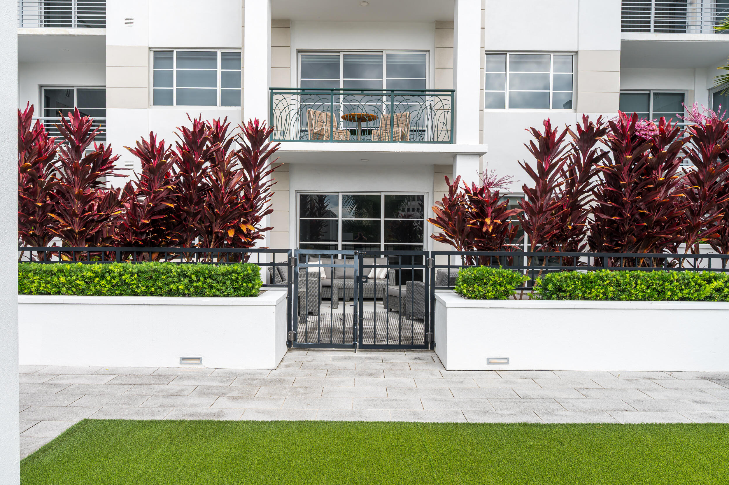 155 East Boca Raton Road, Unit 418 Boca Raton, FL 33432 - Photo 21 of 51 a view of house with a yard and potted plants