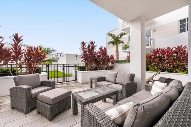 a outdoor living space with furniture and a potted plant