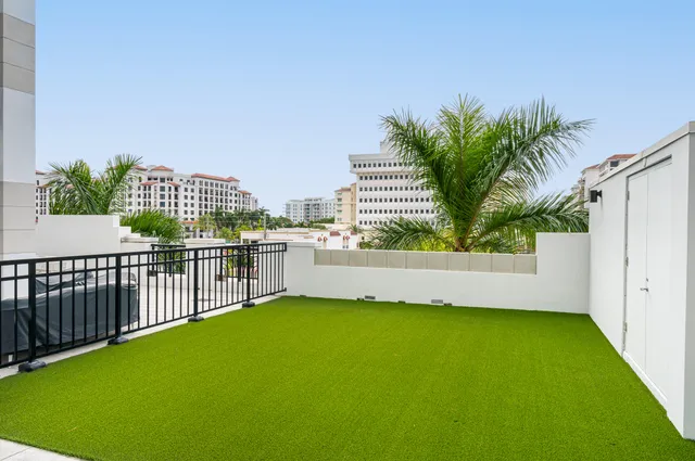 a view of a balcony with a swimming pool