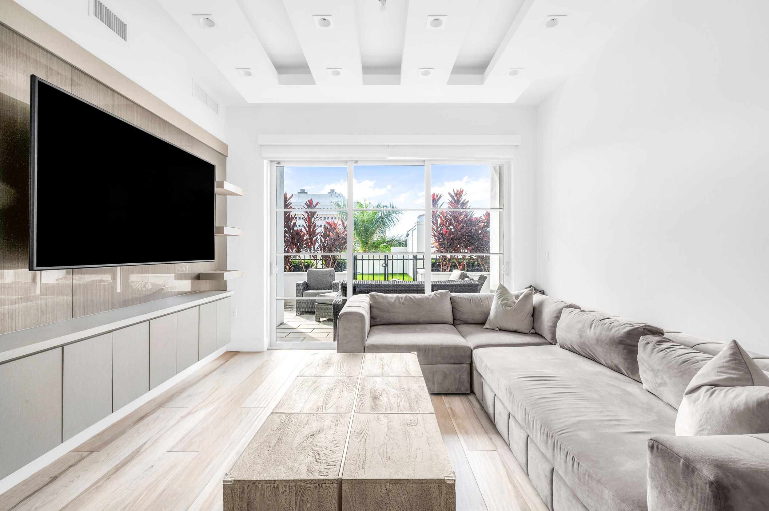 155 East Boca Raton Road, Unit 418 Boca Raton, FL 33432 - Photo 6 of 51 a living room with furniture and a flat screen tv