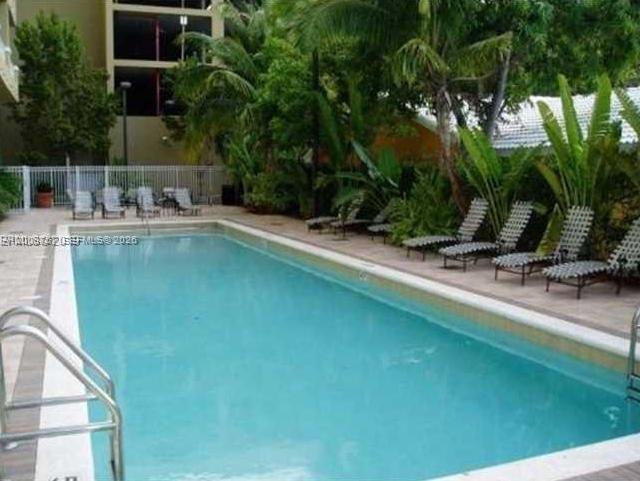2665 Southwest 37th Avenue, Unit 710 Miami, FL 33133 - Photo 12 of 13 a view of a swimming pool with a patio