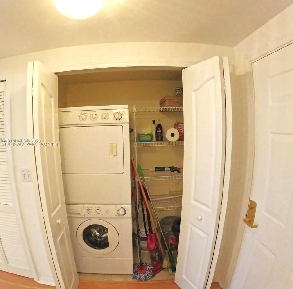2665 Southwest 37th Avenue, Unit 710 Miami, FL 33133 - Photo 6 of 13 a utility room with dryer and washer