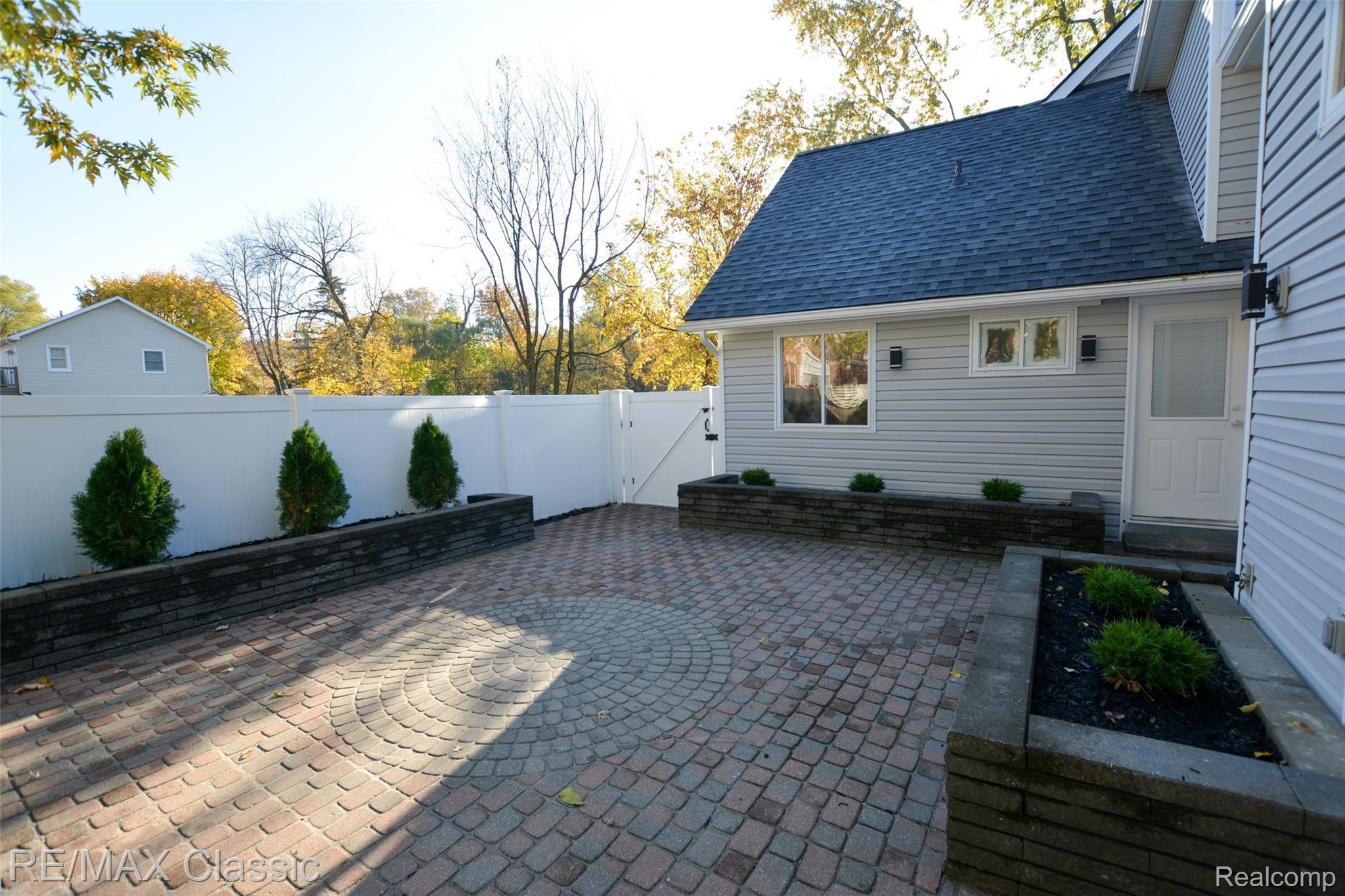 321 Leon Road Walled Lake, MI 48390 - Photo 40 of 53 Spacious Paver Patio & Fenced Yard