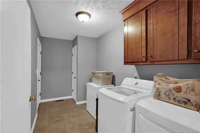 a view of storage and utility room with washer and dryer