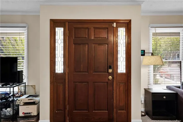 a view of a livingroom with furniture and windows