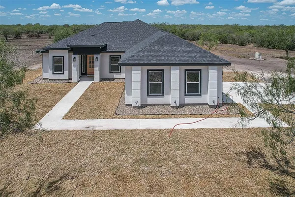 front view of a house with a yard