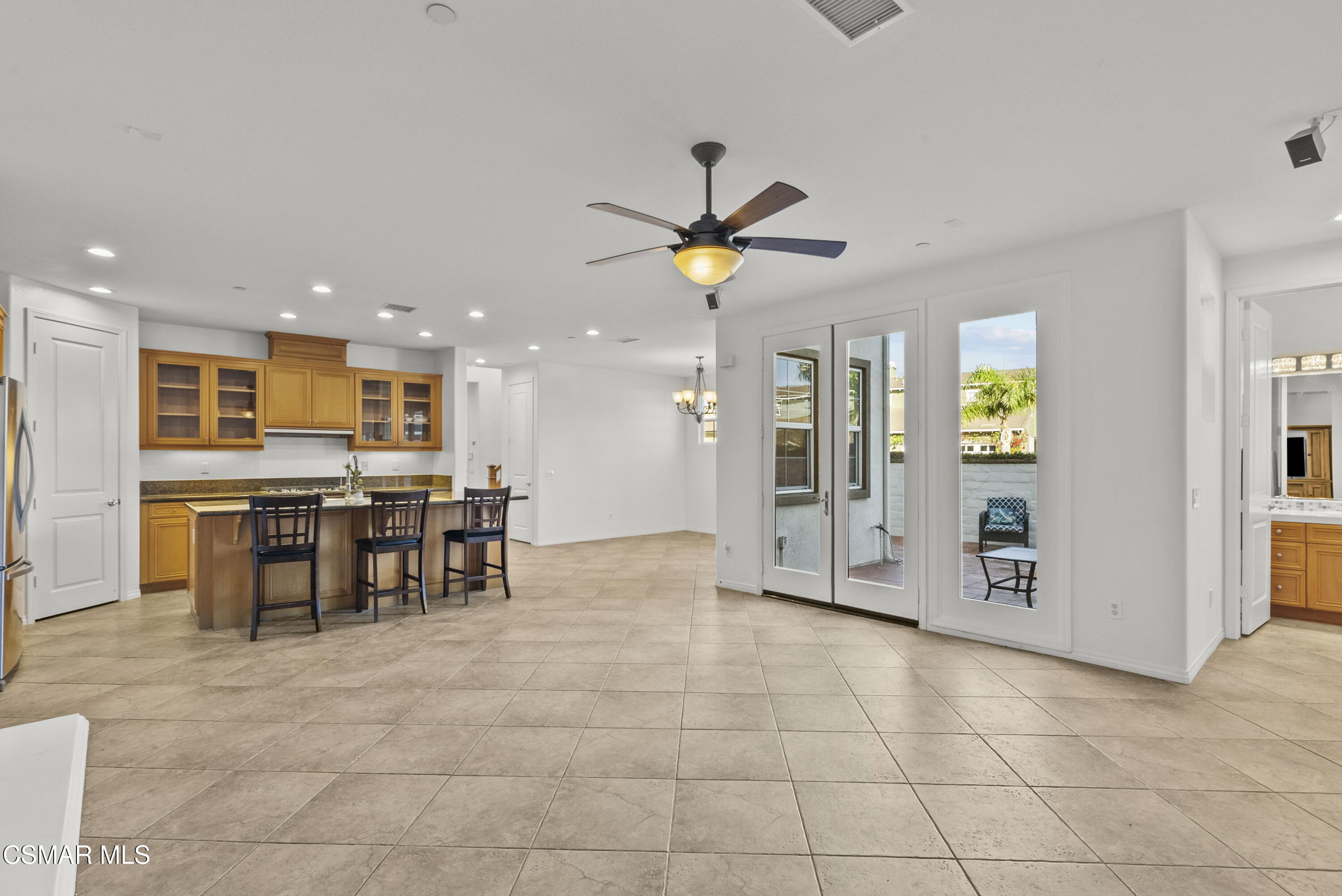 1316 Estuary Way Oxnard, CA 93035 - Photo 12 of 46 a view of kitchen with stainless steel appliances granite countertop dining table chairs sink and cabinets