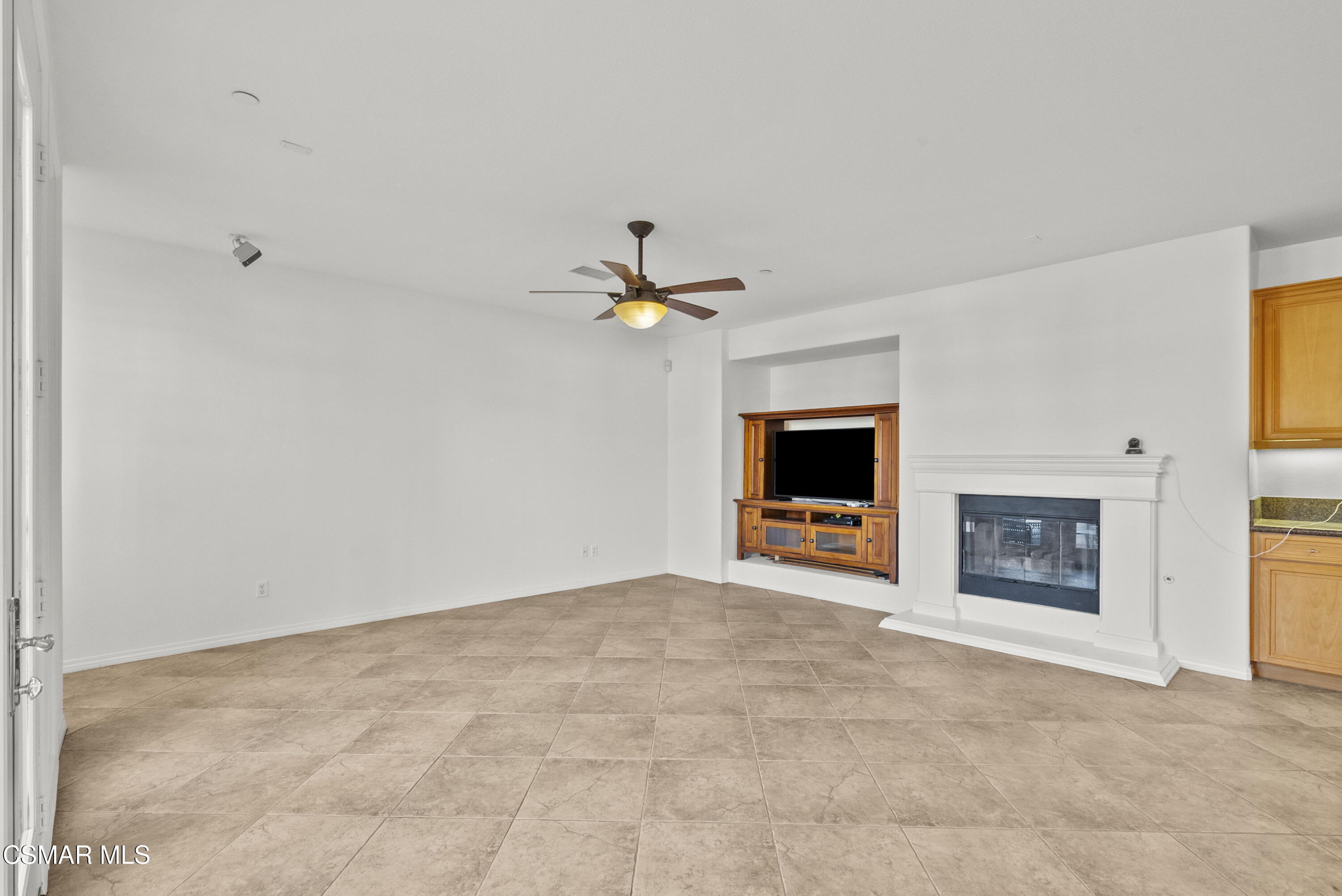 1316 Estuary Way Oxnard, CA 93035 - Photo 14 of 46 a view of a livingroom with a ceiling fan and fireplace