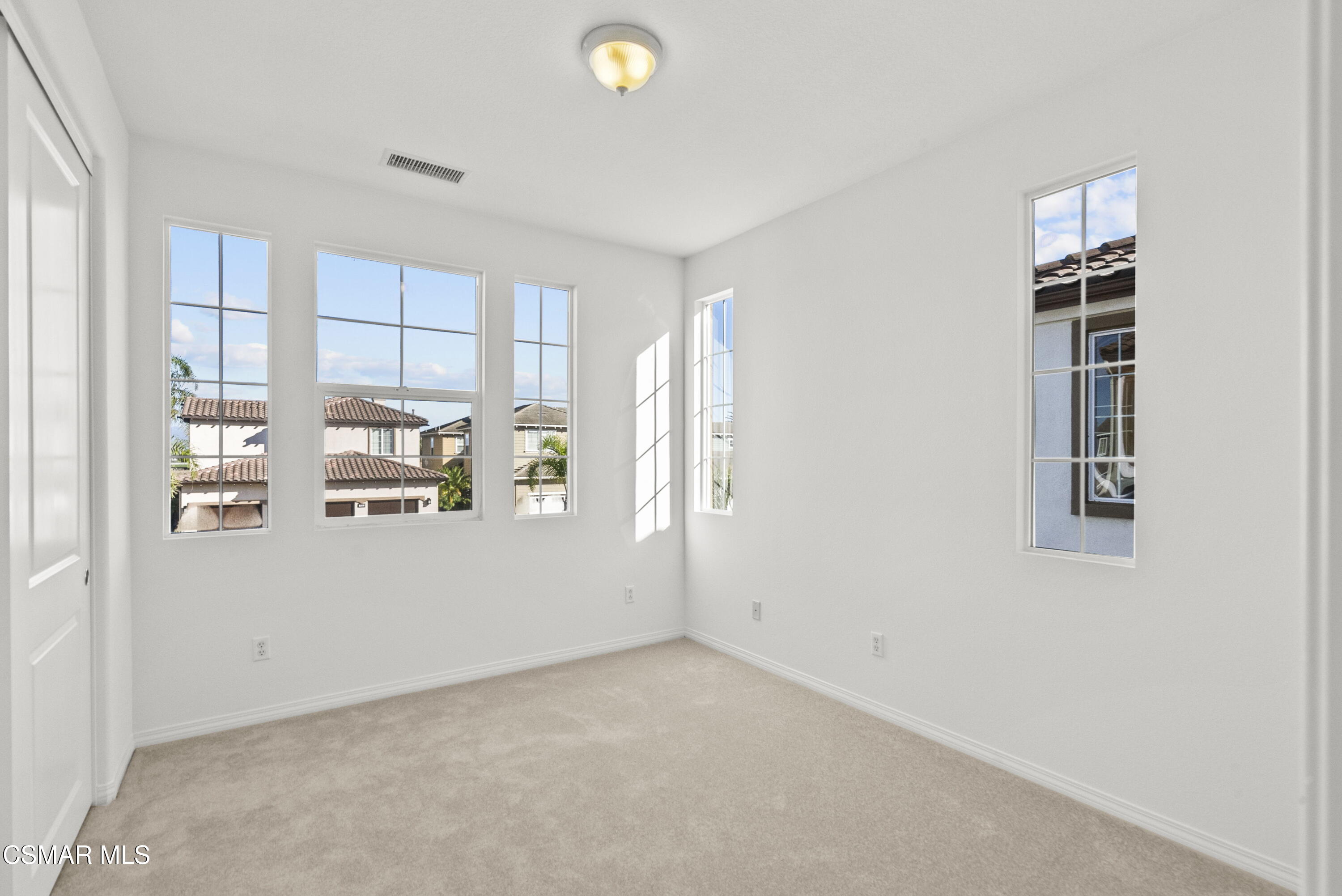 1316 Estuary Way Oxnard, CA 93035 - Photo 25 of 46 a view of a kitchen with wooden floor and windows