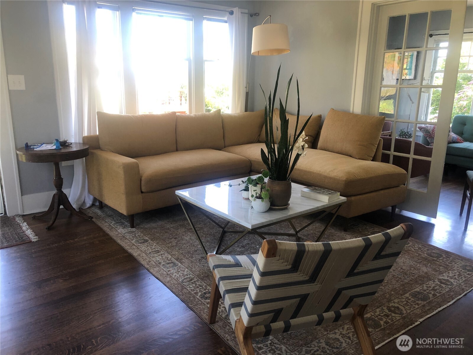 3201 South Charles Street Seattle, WA 98144 - Photo 7 of 25 a living room with furniture and wooden floor