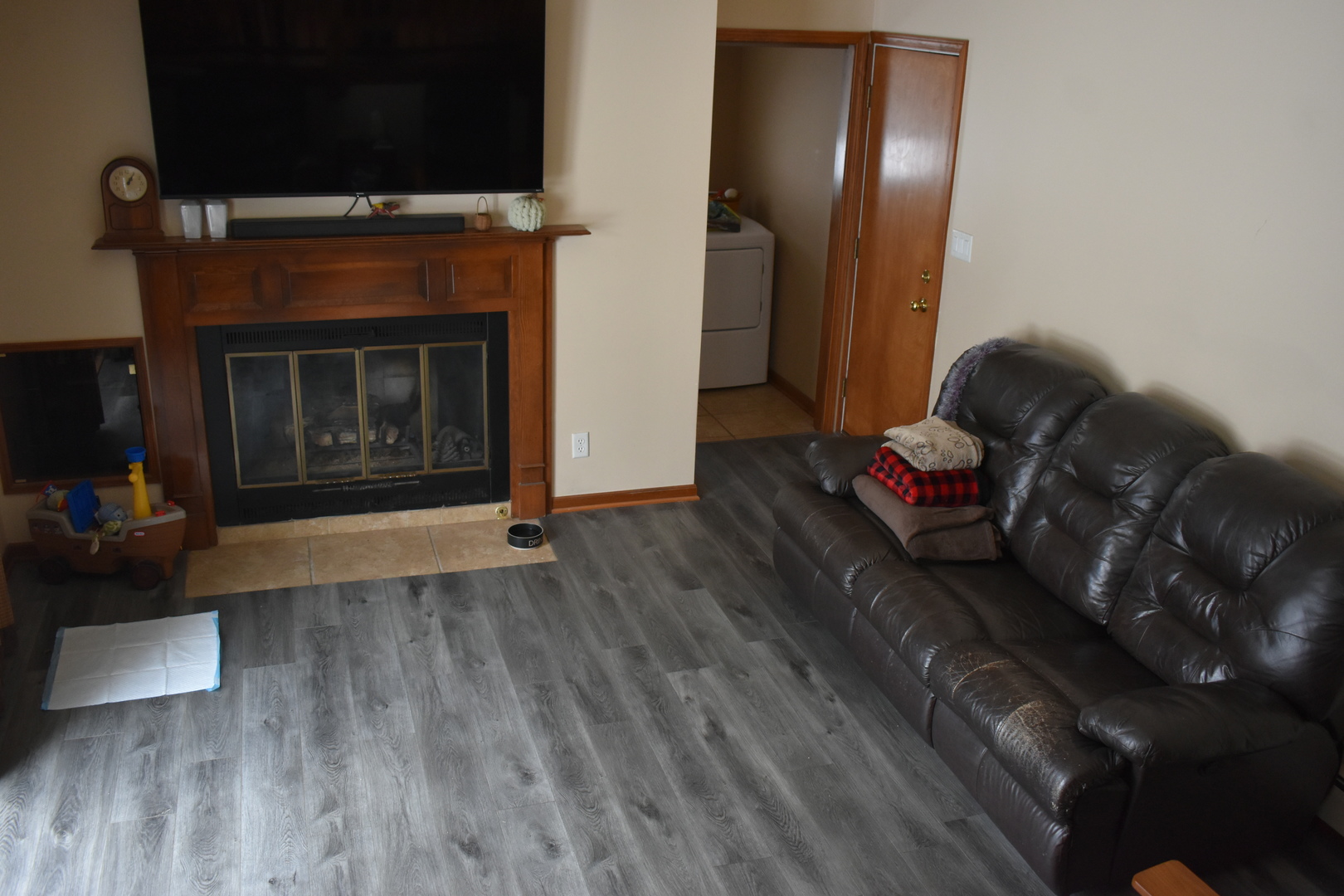 67 Castle Coombe Court Bourbonnais, IL 60914 - Photo 18 of 19 a living room with furniture and a fireplace