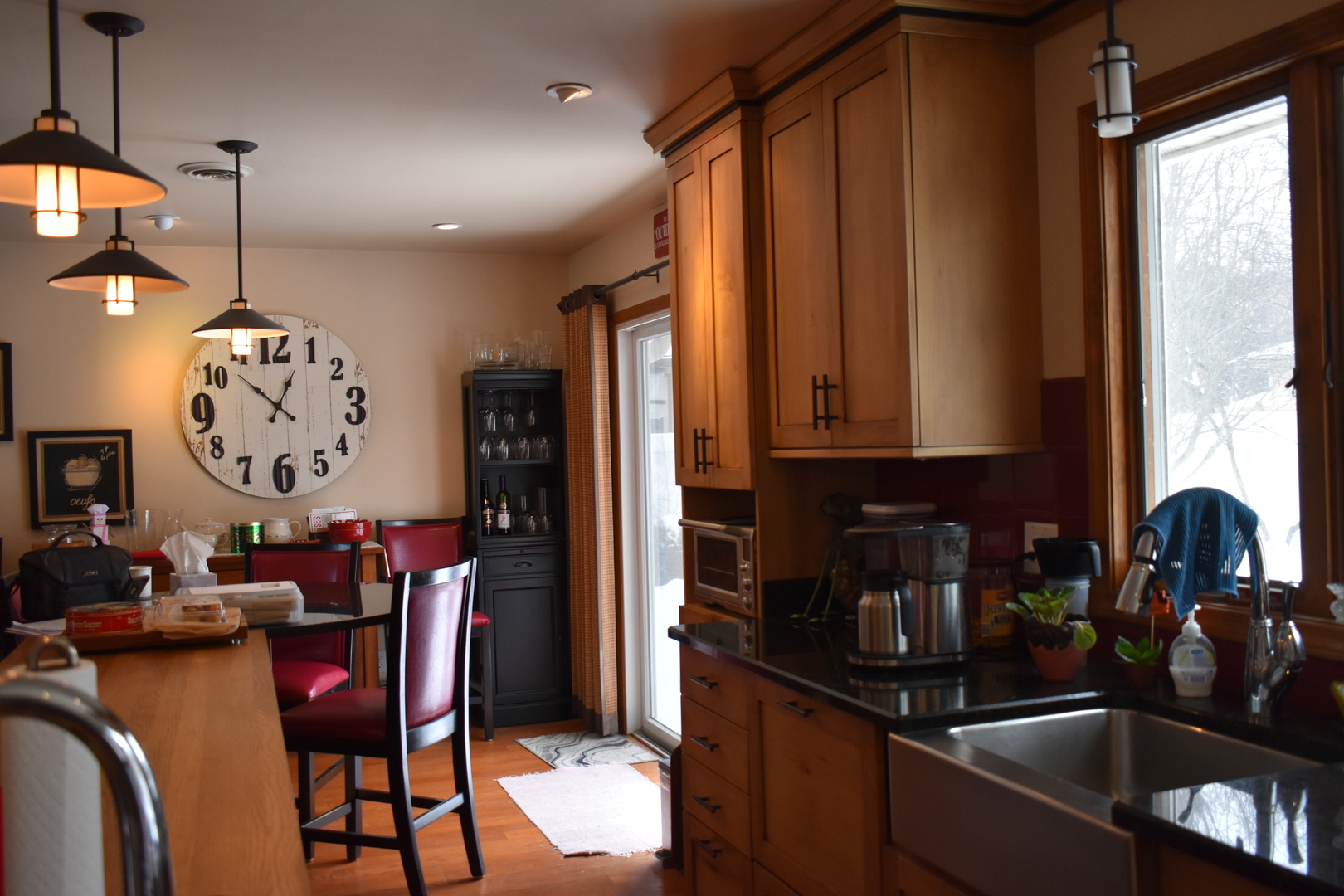 67 Castle Coombe Court Bourbonnais, IL 60914 - Photo 3 of 19 a kitchen with stainless steel appliances granite countertop a sink window and dining table