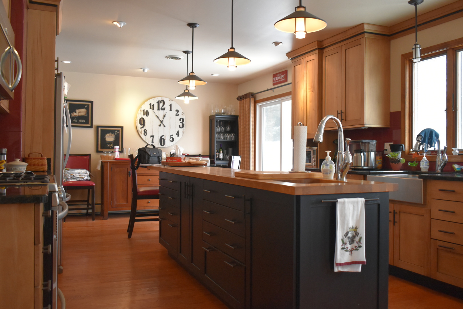 67 Castle Coombe Court Bourbonnais, IL 60914 - Photo 5 of 19 a kitchen with counter top space dining table and stainless steel appliances