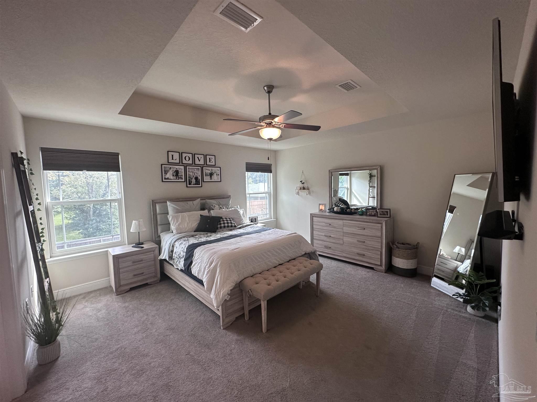 5217 Saufley Field Road Pensacola, FL 32526 - Photo 21 of 26 a bedroom with a bed furniture and a window