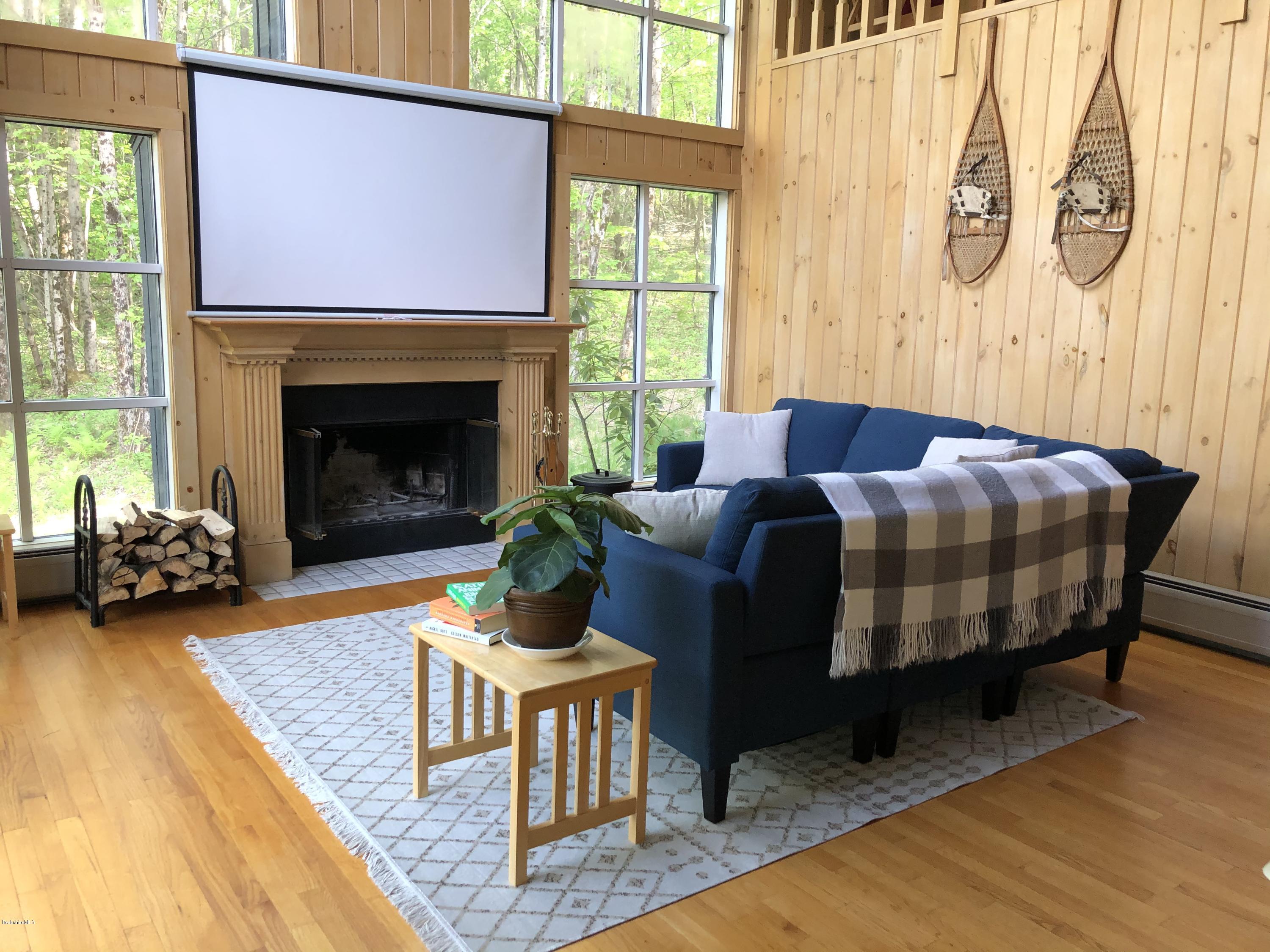 167 Bonny Rigg Hill Road Becket, MA 01223 - Photo 14 of 44 a living room with furniture and a fireplace