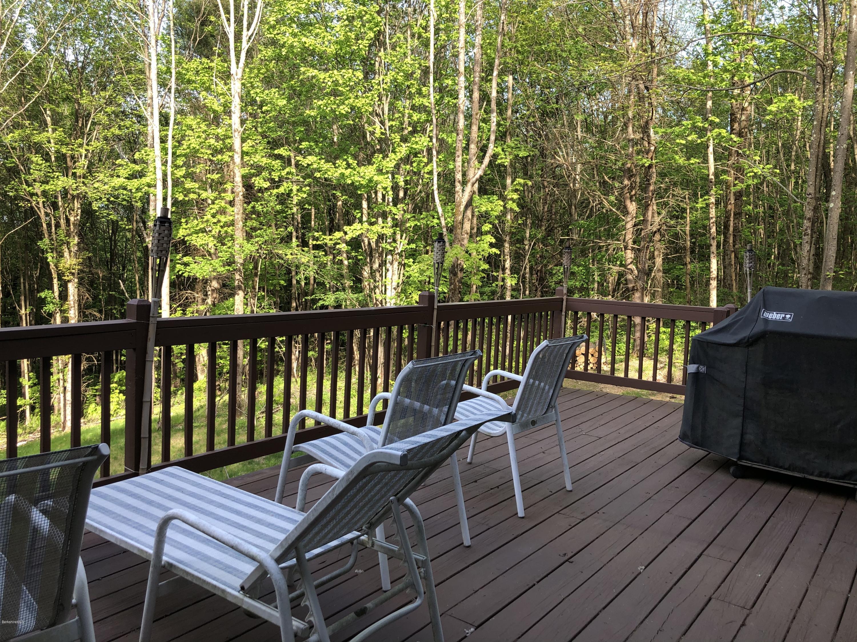 167 Bonny Rigg Hill Road Becket, MA 01223 - Photo 22 of 44 a view of a chairs and table on the wooden floor