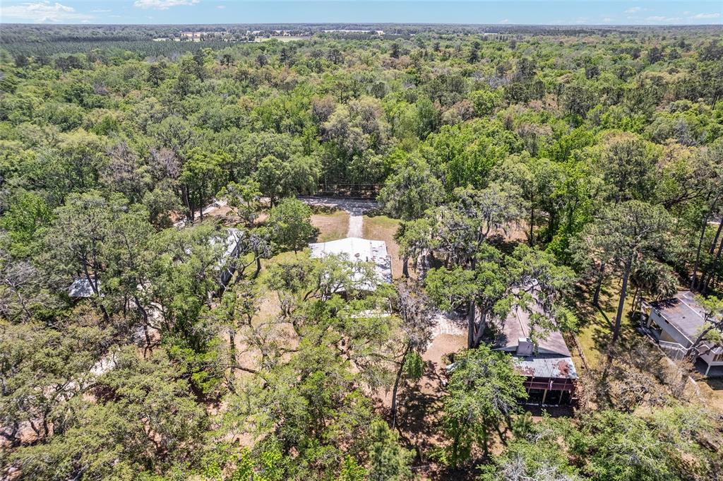 7870 Southwest 25th Place Bell, FL 32619 - Photo 17 of 99 an aerial view of residential houses with outdoor space and trees