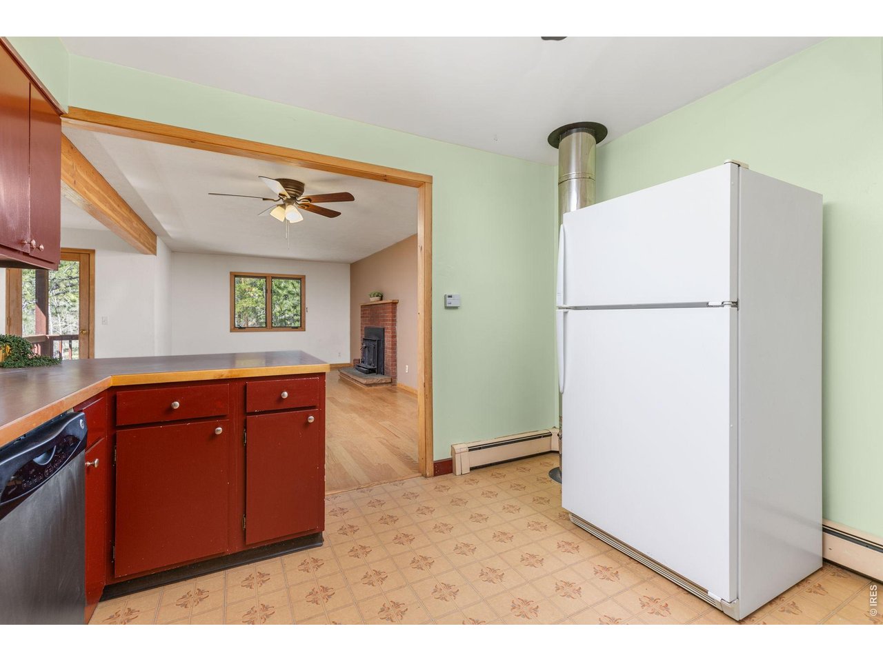 414 Upper Travis Gulch Road Black Hawk, CO 80422 - Photo 17 of 50 a view of kitchen with refrigerator a sink and wooden floor