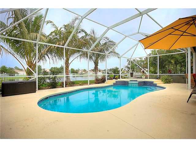2563 Southeast Springtree Place Stuart, FL 34997 - Photo 19 of 20 a view of a swimming pool with a lake view