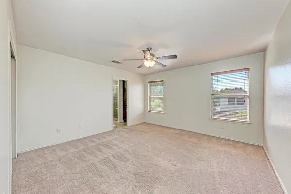 a view of an empty room with a window