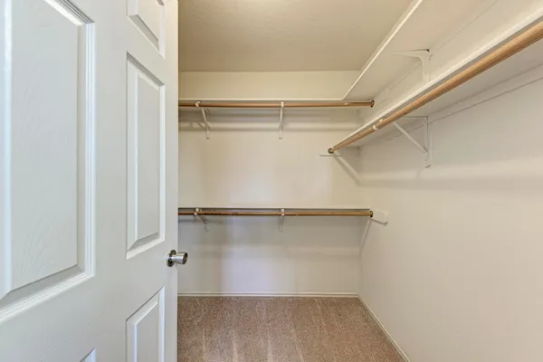 a view of an empty walk in closet