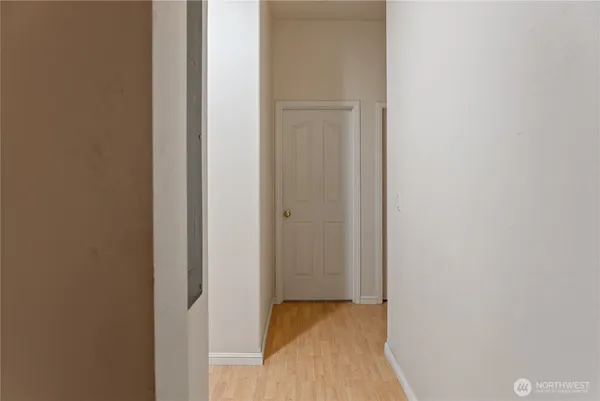 a view of hallway with closet
