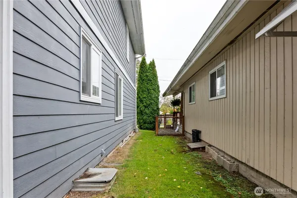 a view of a backyard with sitting area