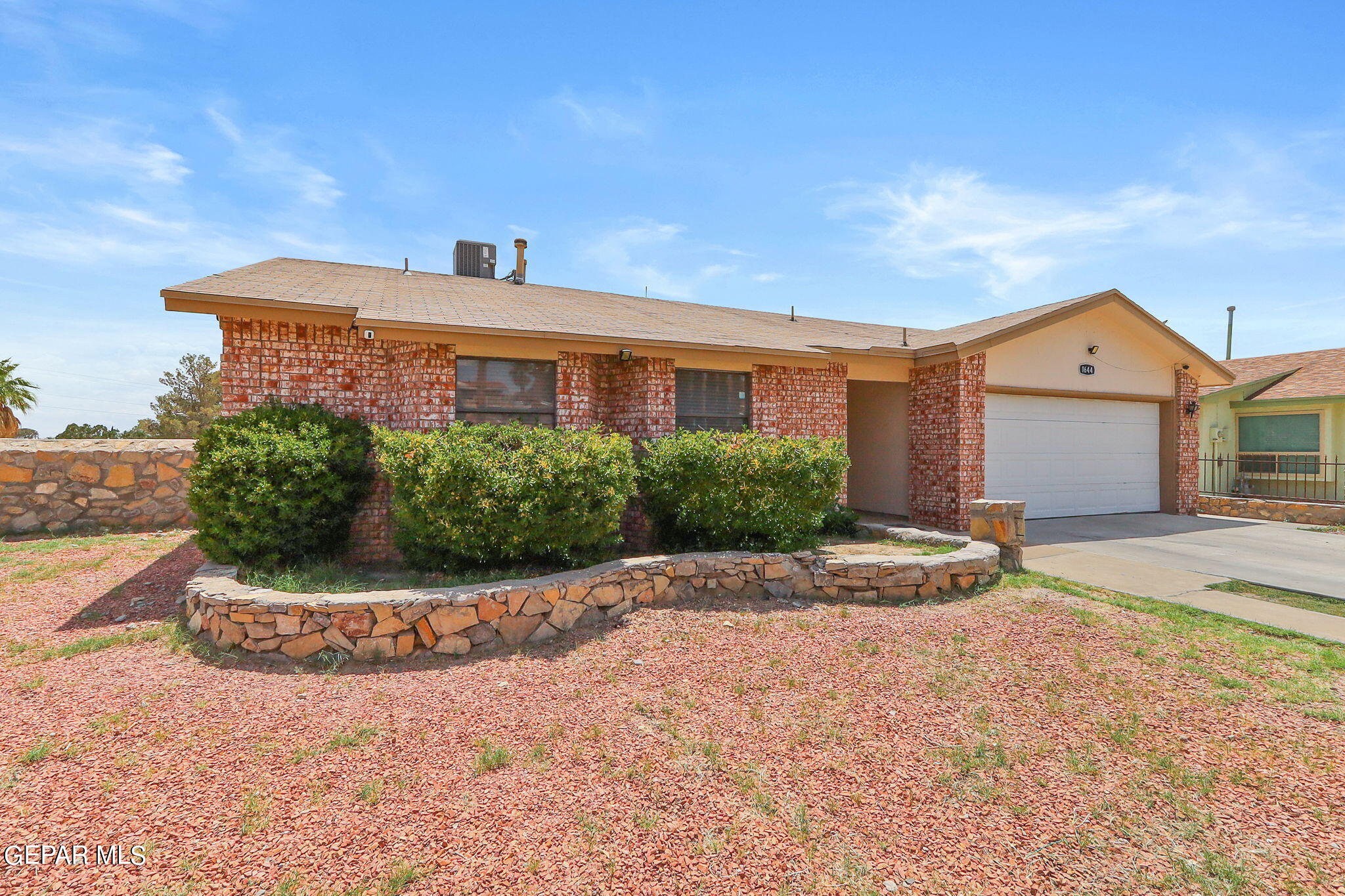 1644 Brian Ray Circle El Paso, TX 79936 - Photo 1 of 1 a front view of a house with a garden