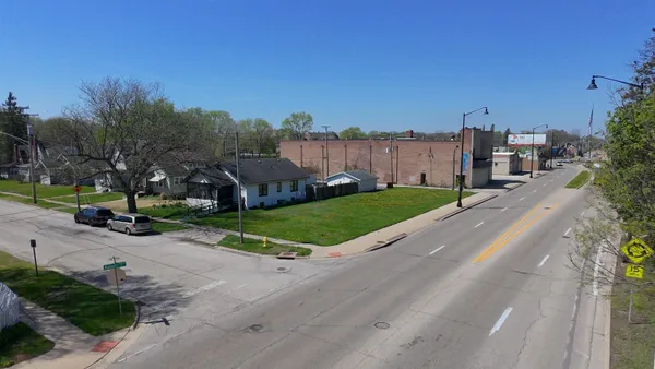 a view of a street with a houses