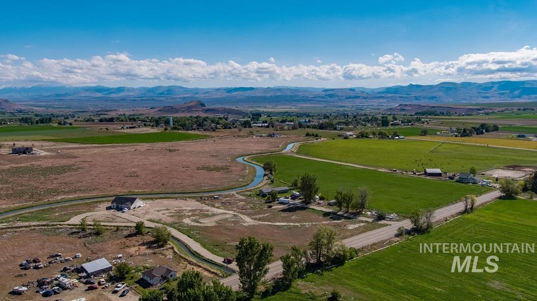 Cs Melba Road Melba, ID 83641 - Photo 6 of 12 Aerial view of sparsely populated area with a mountain backdrop