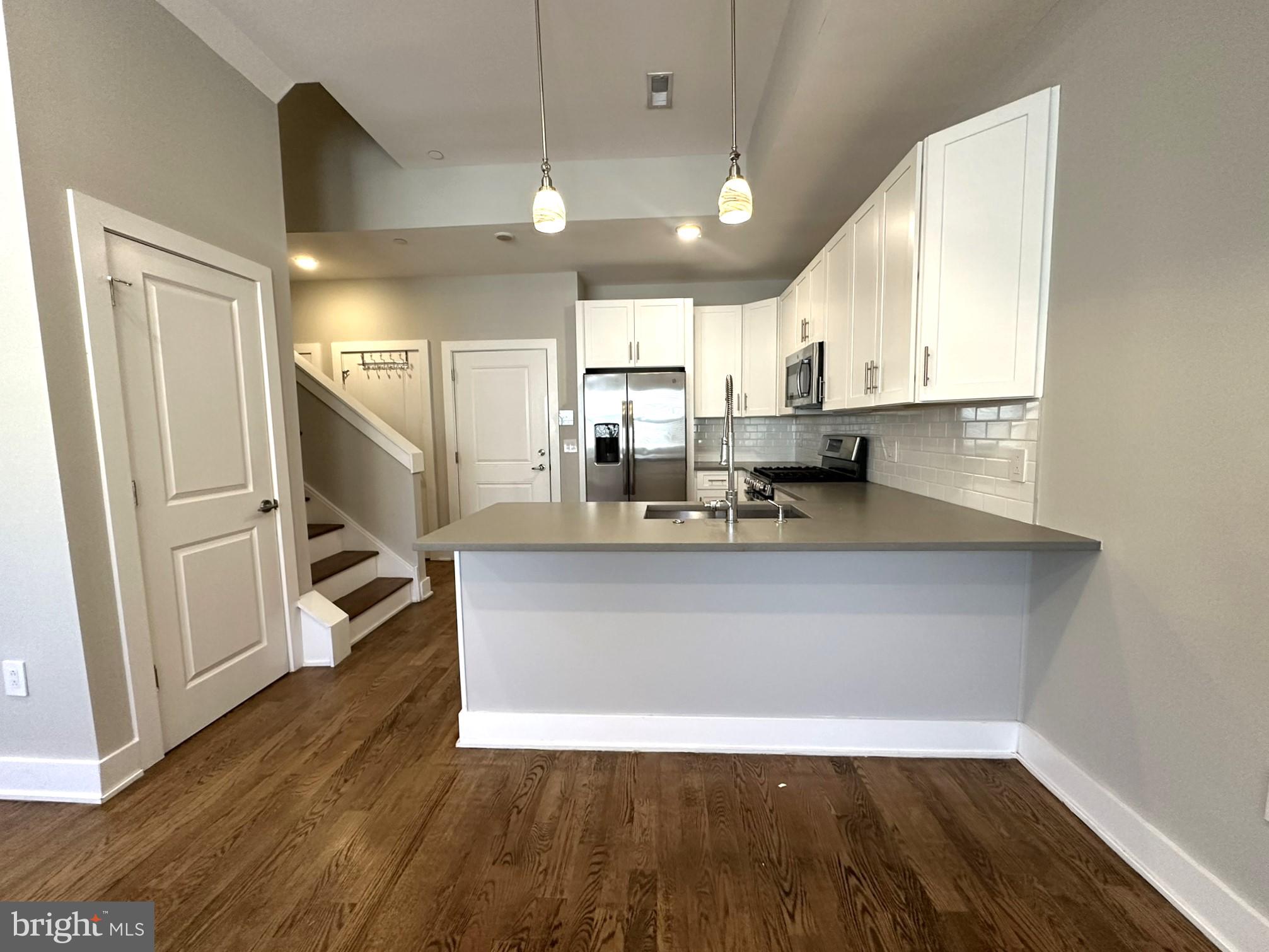 963 Shackamaxon Street, Unit 4 Philadelphia, PA 19125 - Photo 11 of 35 a view of kitchen with stainless steel appliances granite countertop refrigerator sink and stove