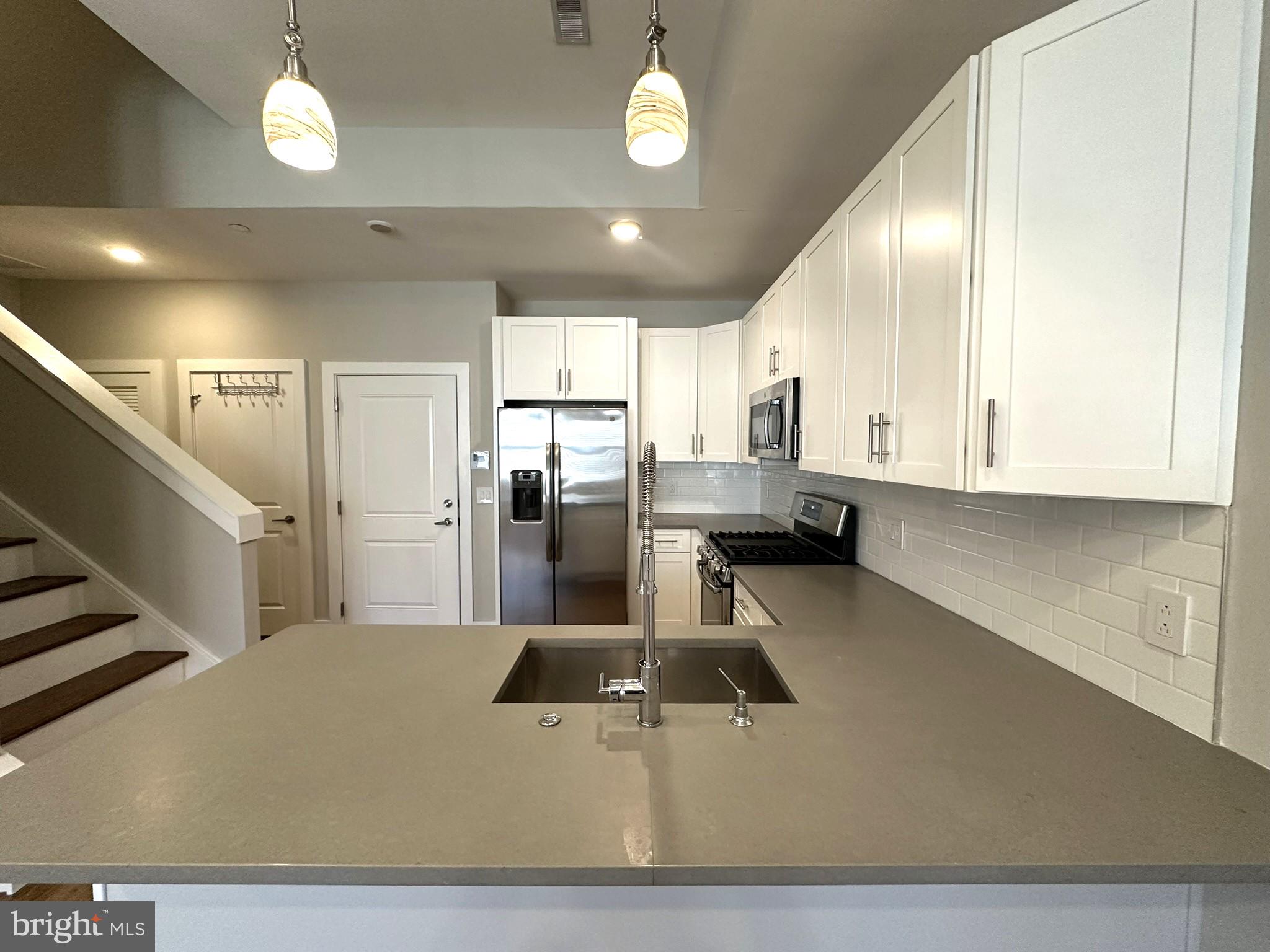 963 Shackamaxon Street, Unit 4 Philadelphia, PA 19125 - Photo 13 of 35 a large kitchen with lots of counter space