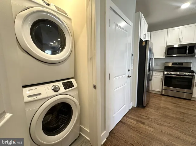 a view of entryway with wooden floor and door