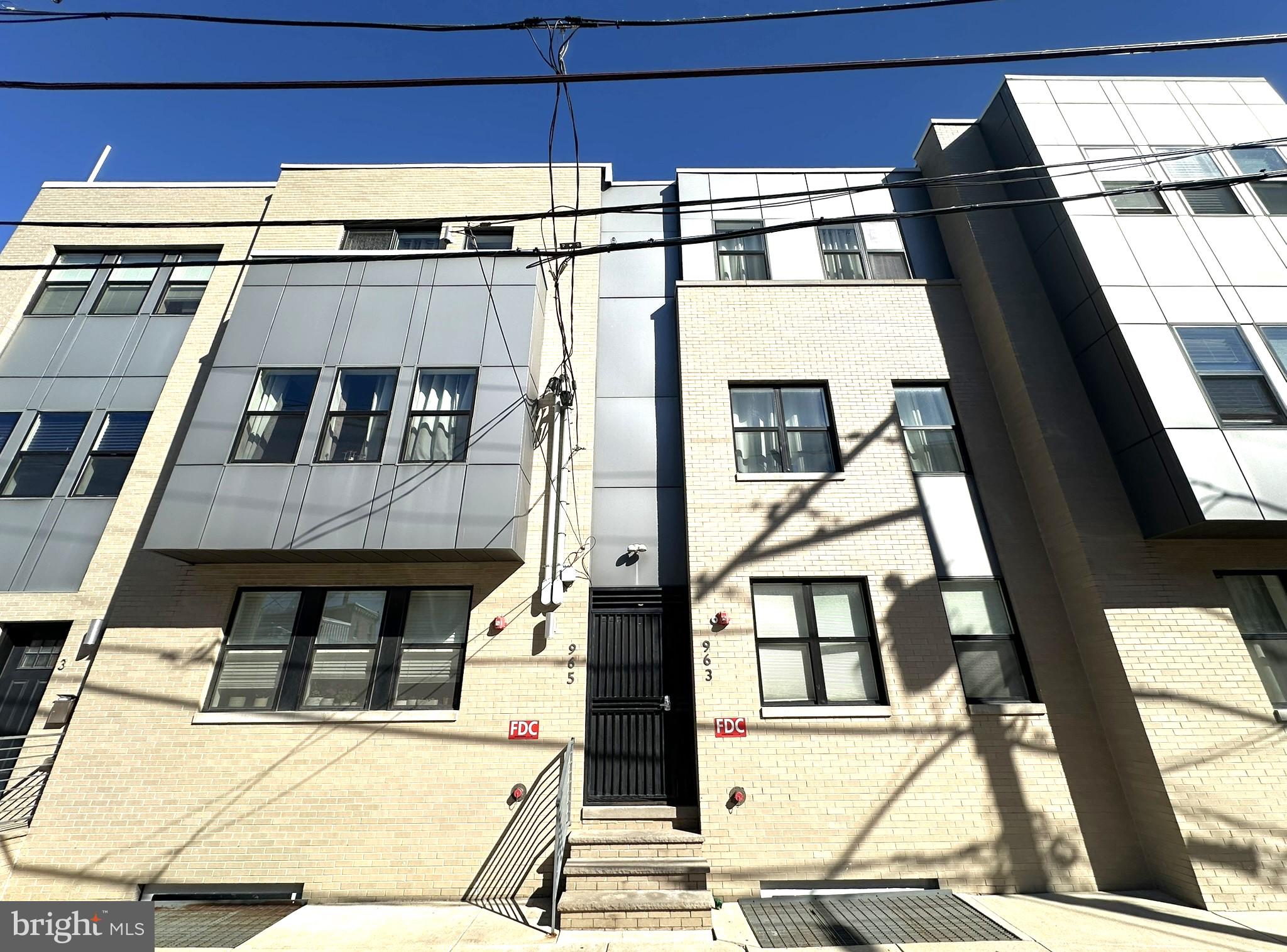 963 Shackamaxon Street, Unit 4 Philadelphia, PA 19125 - Photo 2 of 35 a building with a glass door