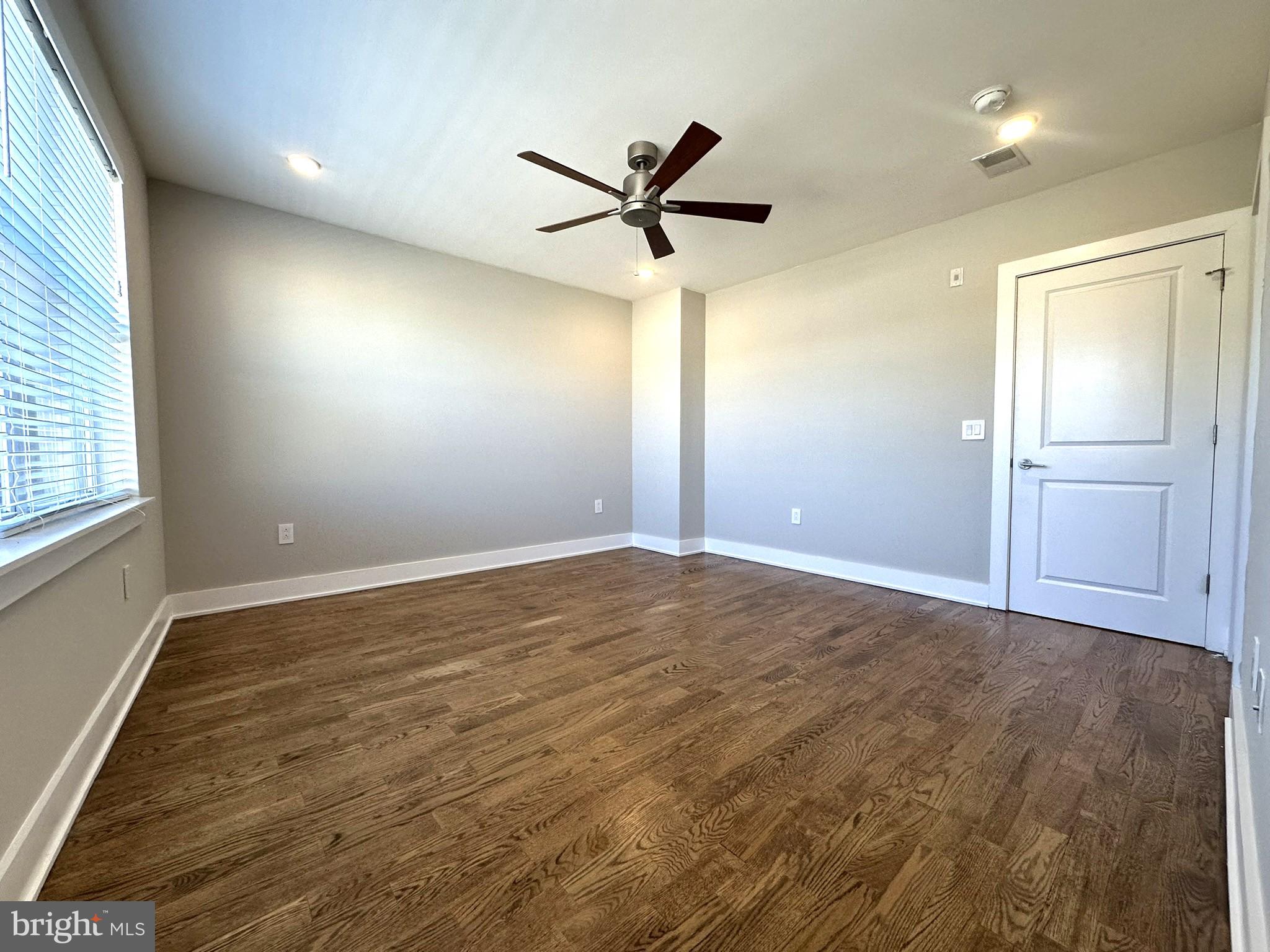 963 Shackamaxon Street, Unit 4 Philadelphia, PA 19125 - Photo 21 of 35 wooden floor in an empty room with a window