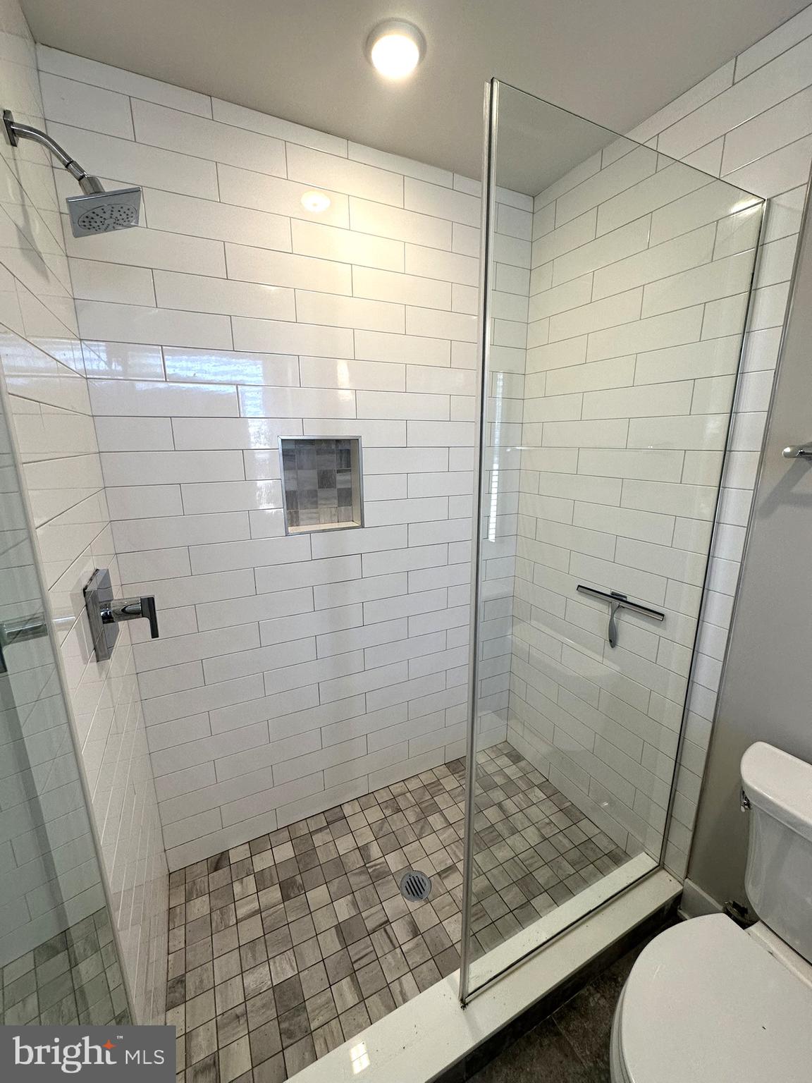 963 Shackamaxon Street, Unit 4 Philadelphia, PA 19125 - Photo 23 of 35 a bathroom with a shower and toilet