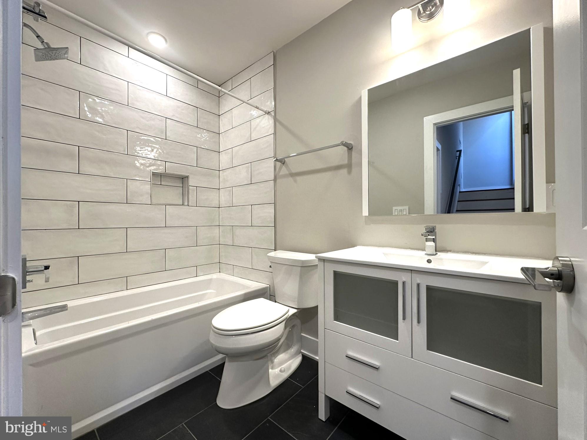 963 Shackamaxon Street, Unit 4 Philadelphia, PA 19125 - Photo 30 of 35 a bathroom with a sink toilet and shower