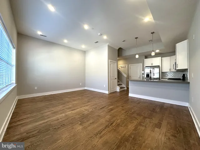 a view of a living room and chandelier