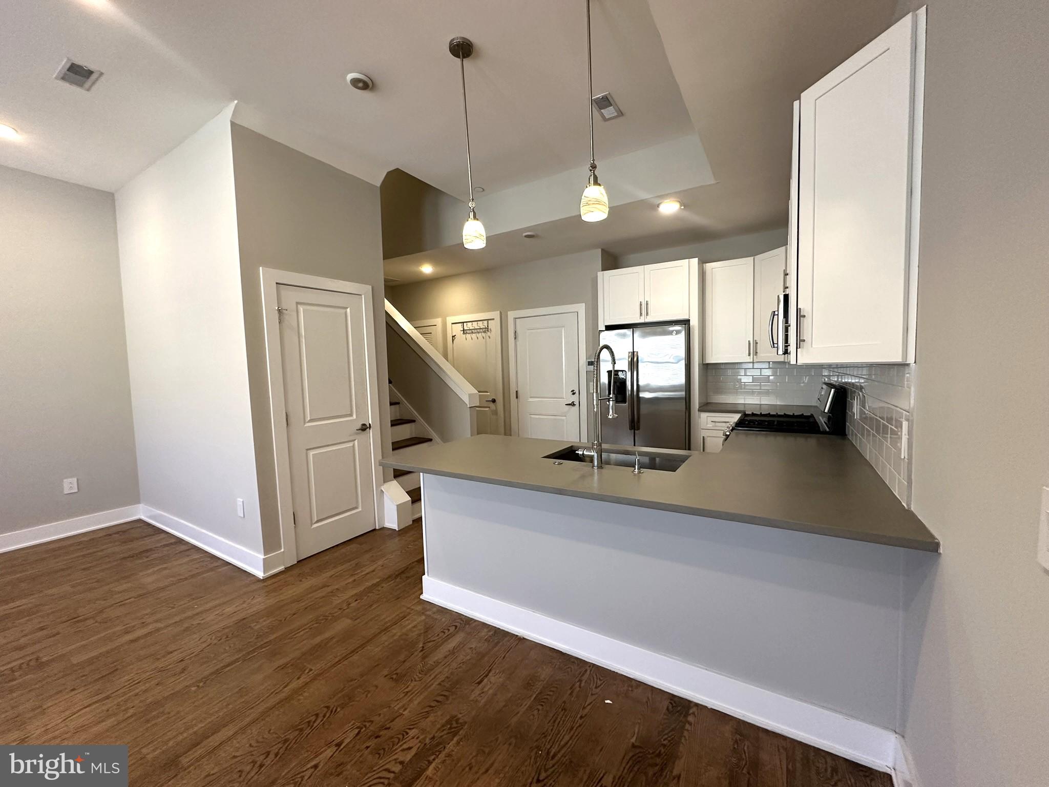 963 Shackamaxon Street, Unit 4 Philadelphia, PA 19125 - Photo 10 of 35 a view of a living room and chandelier