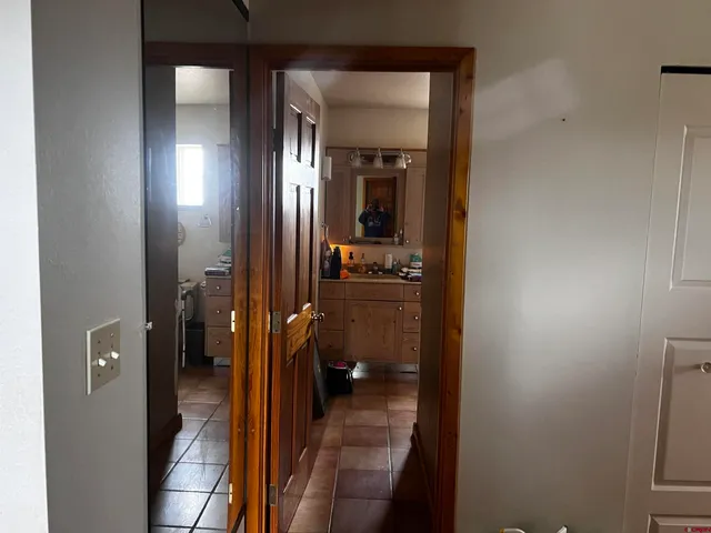 a view of a bathroom from a hallway