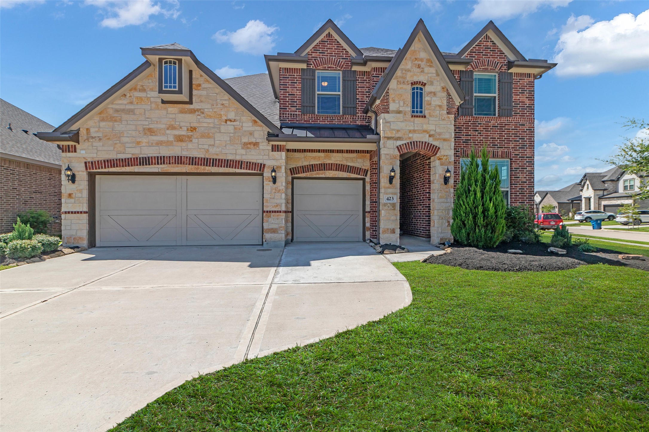 423 Round Top Street Webster, TX 77598 - Photo 1 of 49 a front view of a house with garden