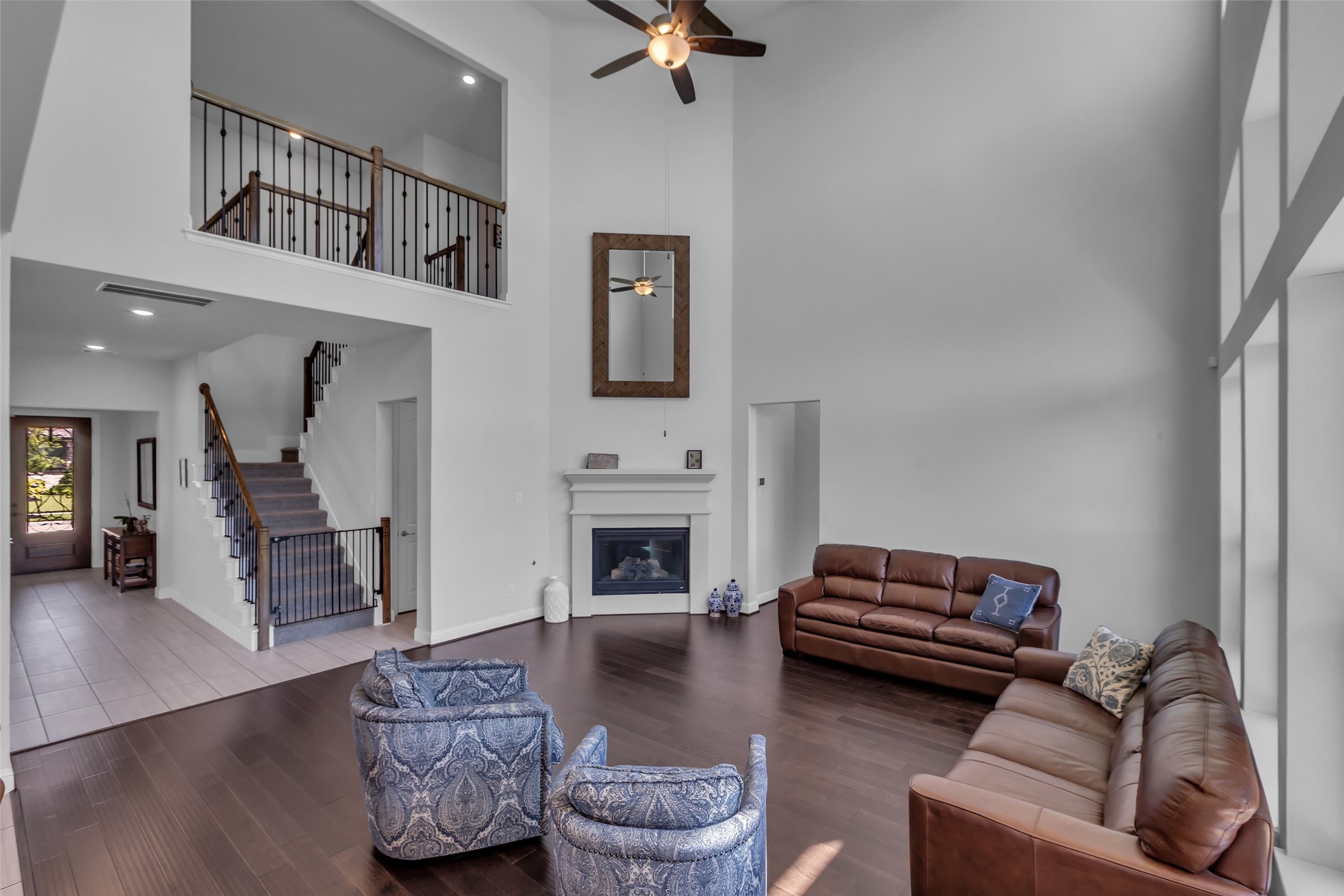 423 Round Top Street Webster, TX 77598 - Photo 12 of 49 a living room with furniture and a fireplace
