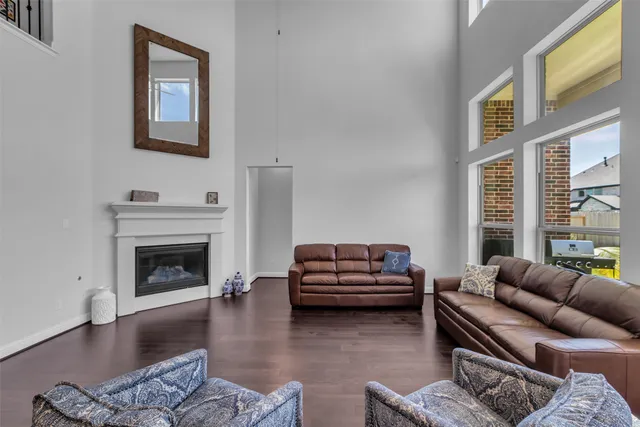 a living room with furniture window and a fireplace
