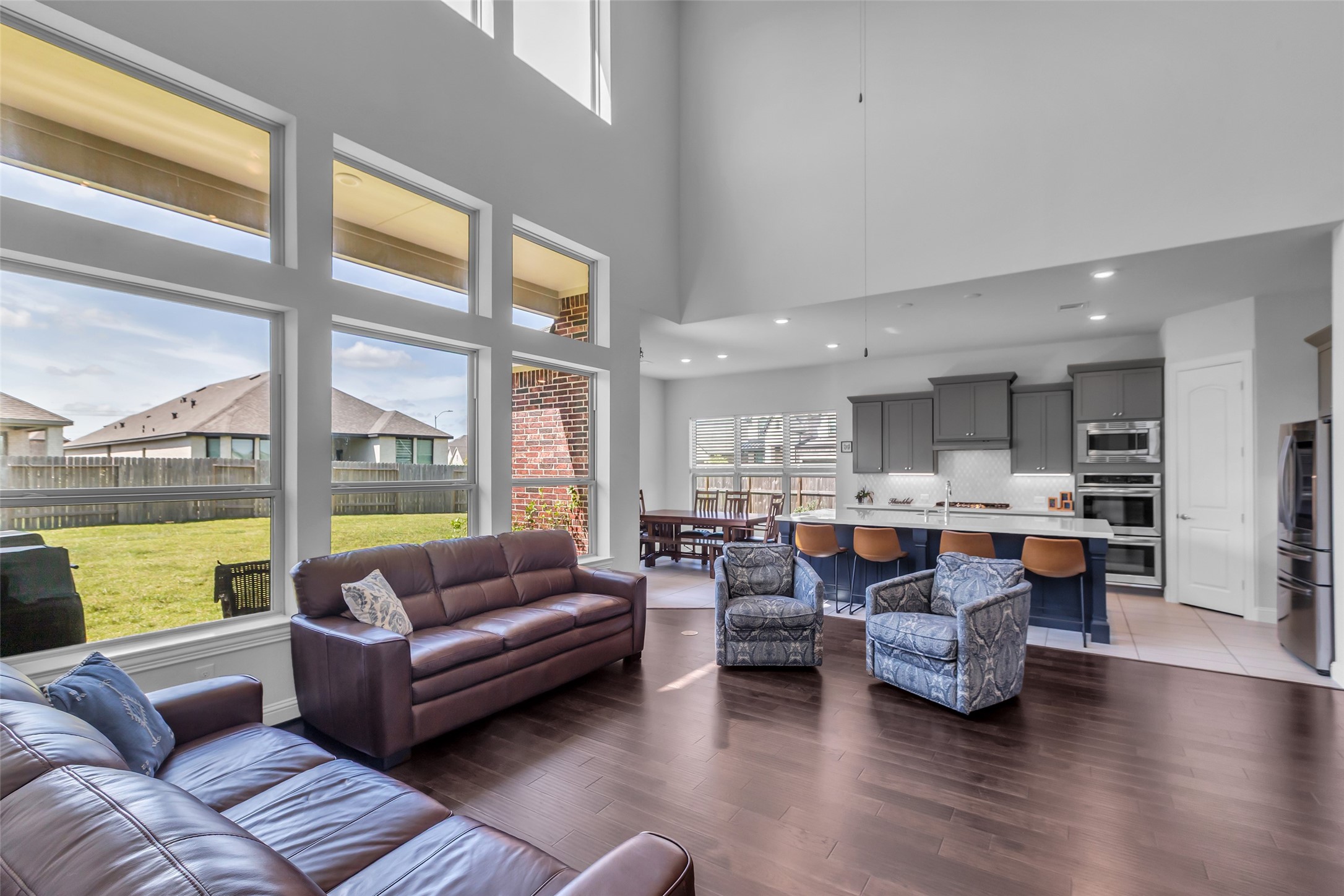 423 Round Top Street Webster, TX 77598 - Photo 14 of 49 a living room with furniture and a large window